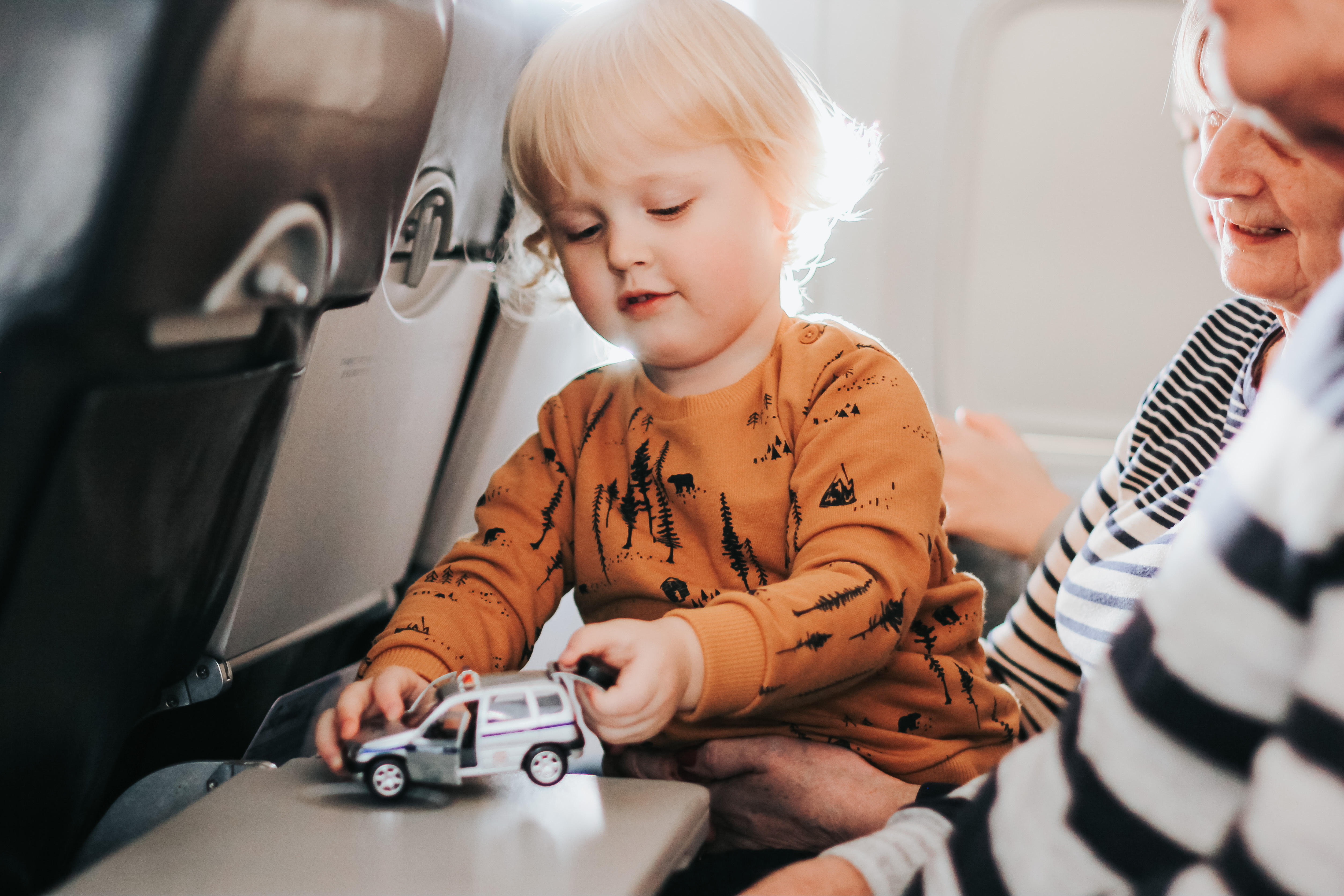 little-cute-boy-having-fun-sitting-on-a-plane-with-2024-11-29-20-34-24-utc